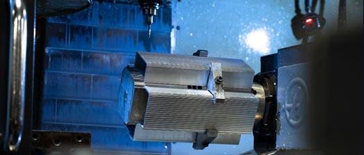 Aluminum component being machined